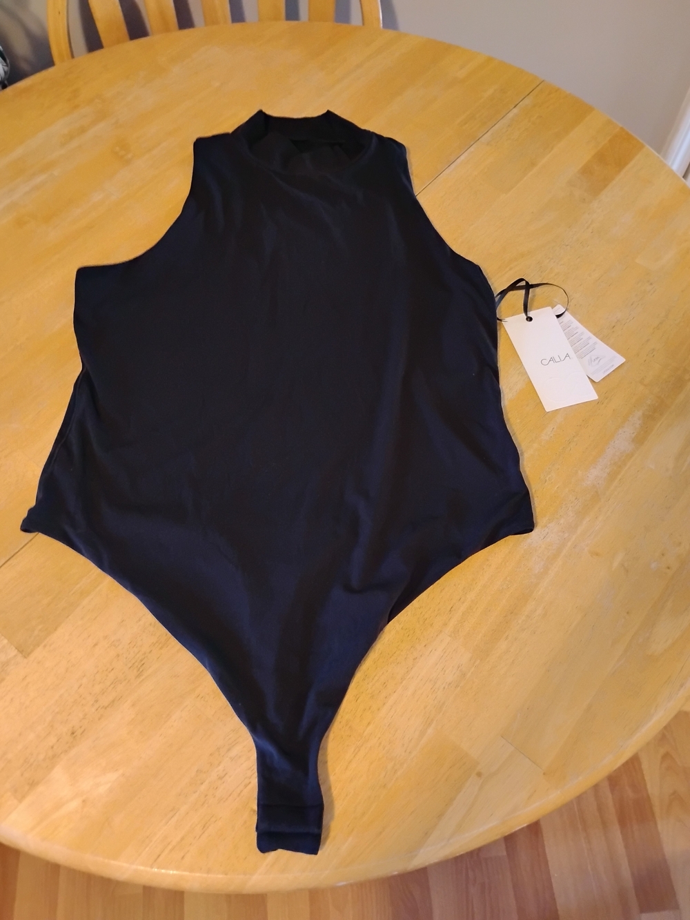 Women's Calia Black Sleeveless One-Piece Bodysuit.